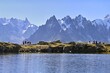 © Stefan Huwiler/imageBROKER - A group of hikers at Lac de Chésserys, behind the snow-covered Mont Blanc massif, Chamonix-Mont-Blanc, Haute-Savoie, France