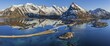 © Martina Melzer/imageBROKER - Aerial view of bridge, fjord, steep mountains, coast, winter, panorama, evening light, reflection, Moskenesoya, Lofoten, Norway