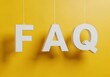 © Isaqiel - White faq letters hanging on strings against a yellow background, representing frequently asked questions