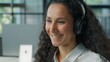 © Yuliia - Hispanic ethnic business woman call center manager talking video call in headset Arabian businesswoman female girl help line agent customer service talk with client conversation in office helpline