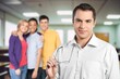 © BillionPhotos.com - Portrait Of Male smart Teacher Standing at College Building