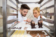 © auremar - chocolatier inspecting cooled chocolates on a rack