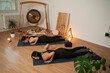 © phoenix021 - Two women relaxing , meditating together, laying on their belly resting and breathing, gong in background