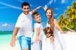 © BillionPhotos.com - Happy young family at holidays at sand beach.