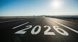 © Vyatcheslav - The year 2020 painted on an empty highway road stretching to the horizon. Concept of a new year, future journey, and progress forward
