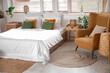© Pixel-Shot - Interior of cozy bedroom with armchair and table