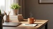 © Deden - A cozy and bright home office desk setup with a laptop, books, plant, and steaming coffee mug.