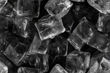 Close-up view of many ice cubes in a dark setting. Seamless pattern.