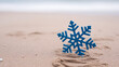 © StockClarity - Blue Snowflake Decoration Standing in Beach Sand with Ocean Background image photo