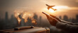© The Pixel Store - Global travel planning with smartphone and airplane concept at sunset over cityscape