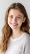 © Naiuang - Modern Studio Portrait Highlighting Clear Braces on a Confident Teenager with a Fresh White Background