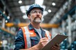 © ffunn - a professional worker in an industrial plant is talking to his colleagues while holding a clipboard and wearing safety glasses.