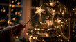 © Viacheslav - Christmas tree, A person holds a glowing star-tipped wand