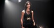 © peopleimages.com - Woman, model and runway with event for fashion show, garment collection or designer brand. Person, crowd or audience with clothing line or outfit for publicity or new aesthetic trend on catwalk