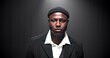 © peopleimages.com - Runway, black man and portrait of model at fashion show for clothing brand, collection or label launch. Serious, elegant and male person on catwalk for designer line with stylish outfit at event.