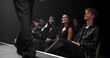 © peopleimages.com - People, crowd and catwalk with smile for fashion show, garment collection or designer brand. Group, audience or performance with clothing line or outfit for publicity, new aesthetic trend or wardrobe