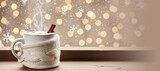 Hot steamy cup of cocoa with cinnamon and white knitted sleeve on wooden table. Cozy winter day and Christmas celebration background with copy space. Banner with copy space