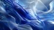 © MuhammadSaghar - Abstract flowing blue and white gradient fabric waves create soft texture.