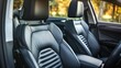 © ds17 - Interior of a modern car featuring black leather seats. The design is sleek and ergonomic, suitable for comfort during travel.
