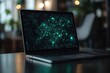 © Vibu design  gallery - A laptop screen displays an intricate glowing green digital network of nodes and connecting lines, symbolizing data, AI, and technological connectivity.