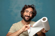 © kues1 - young adult bearded man with a paper towel roll