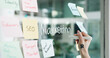 © AzeemudDeen25/peopleimages.com - Advertising, hands and writing on glass wall for business growth, seo plan or target audience trends. Marketing, increase awareness and person at board with sticky note, strategy or goal for campaign