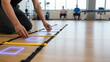 © newlifestock - Physical therapy. balance fall prevention seniors therapist sets up agility ladder for group exercise to improve strength coordination