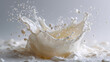 © Sabana - Close up shot of a milk splash with droplets suspended in air against a grey background