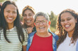 © Sabrina - Multiracial women smiling on camera at city park - Multi generational group of people outdoor - Community, diversity and feminism concept
