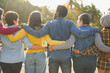 © Sabrina - Group of multiracial people hugging each other at city park - Back view of multi generational community outdoor - Humanity, social inclusion and diversity concept