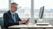 © Passionwith - Businessman working in office using his smartphone
