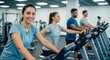 © ANDREY PROFOTO - Smiling woman exercising on stationary bike in modern gym