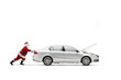 © Ljupco Smokovski - Santa Claus pushing a car with an open hood