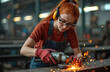 © Pete - Girl grinds metal with grinder in workshop wearing safety glasses. Sparks fly during metalwork. Female technician works in industry with protection equipment. Young apprentice demonstrates occupation