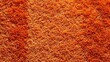 © Elena - Close-up of a vibrant orange shag carpet texture. Plush, soft textile background with long fibers. Abstract home decor and flooring material