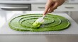 © photoplotnikov - Spreading green paste in kitchen with white spatula