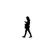 © Farhan - Silhouette of woman using smartphone walking, representing modern mobile lifestyle and connectivity concept