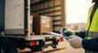 © ViskBx - Worker with clipboard inspecting cargo in truck for delivery and signing off on the shipment manifest