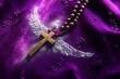 © smartcat - Wooden rosary cross with beaded chain resting on deep purple velvet beside powdered angel wings and glitter, evoking serene reverence and quiet devotion