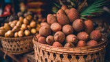 Fresh salak fruits in a wicker basket at a traditional market, exotic tropical snake display