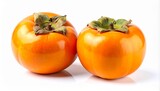 Two fresh ripe persimmons on a white background, vibrant orange fruit with green calyx, healthy eating and autumn harvest concept
