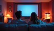 © Maryna - Couple watches movie in comfy living room theater, popcorn machine nearby. Enjoying cinema at home, relaxation, togetherness, entertainment, casual, domestic scene, cozy ambiance, romantic evening.