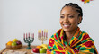 © Ksenia Pestereva - Capturing spirit of Kwanzaa with young woman, celebrating unity and heritage. Kwanzaa traditions are vibrant, symbolized by beautiful girl wrapped in patterned cloth, showcasing pride.