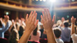 © amanullahkhan - Enthusiastic audience applauding performance with hands raised in standing ovation, showing appreciation and excitement at theatrical event or concert