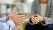 © liliyabatyrova - Two pairs of hands convey a silent connection during a counseling session. A chaplain's hands reach out to offer guidance, while an employee's hands show vulnerability and openness