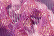 © Westend61 - 3d abstract wave pattern with pink and purple lines and shadows