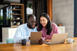 © NDABCREATIVITY - Online entertainment and social media. Diverse, multiethnic couple enjoying the digital world
