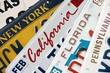 © mehaniq41 - Old US car license plates with various state names close up. Concept of driving in United States. Reaching a car registration