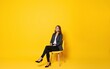 © Samuel - Full body length photo of beautiful pretty woman wear smart casual outfit look empty space satisfied relax chair isolated on yellow color background. High quality