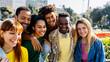 © Xavier Lorenzo - Happy diverse group of millennial students and best friends enjoying time together outdoors on a sunny day, laughing and bonding at the city street. Youth, friendship, and positive lifestyle concept.